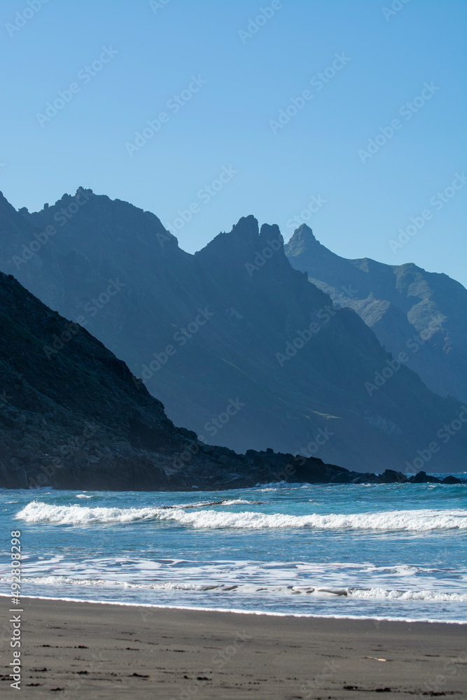 Panoramic view on lava rocks of laya de Almaciga and blue Atlantic ocean, Anaga national park near Tanagana village, North of Tenerife, Canary islands, Spain Panoramic view on lava rocks of laya de Almaciga and blue Atlantic ocean, Anaga national park near Tanagana village, North of Tenerife, Canary islands, Spain