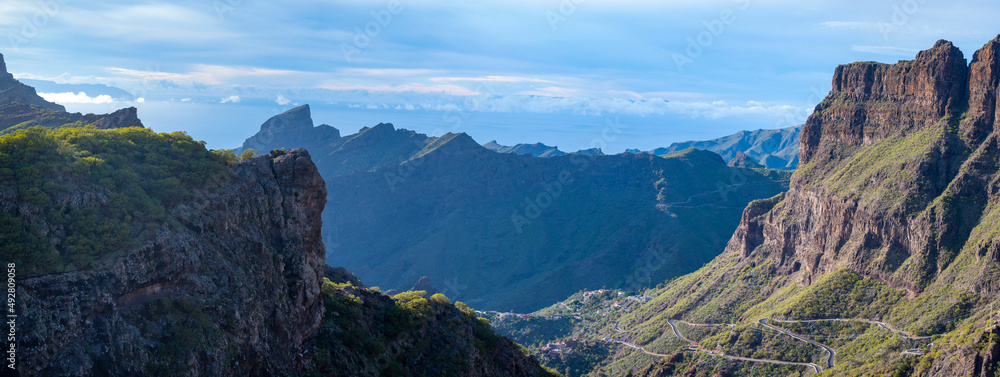 Mountains range in Rural de Teno park near isolated village Masca on Tenerife and La Gomera island on background, Canary islands, Spain - obrazy, fototapety, plakaty 