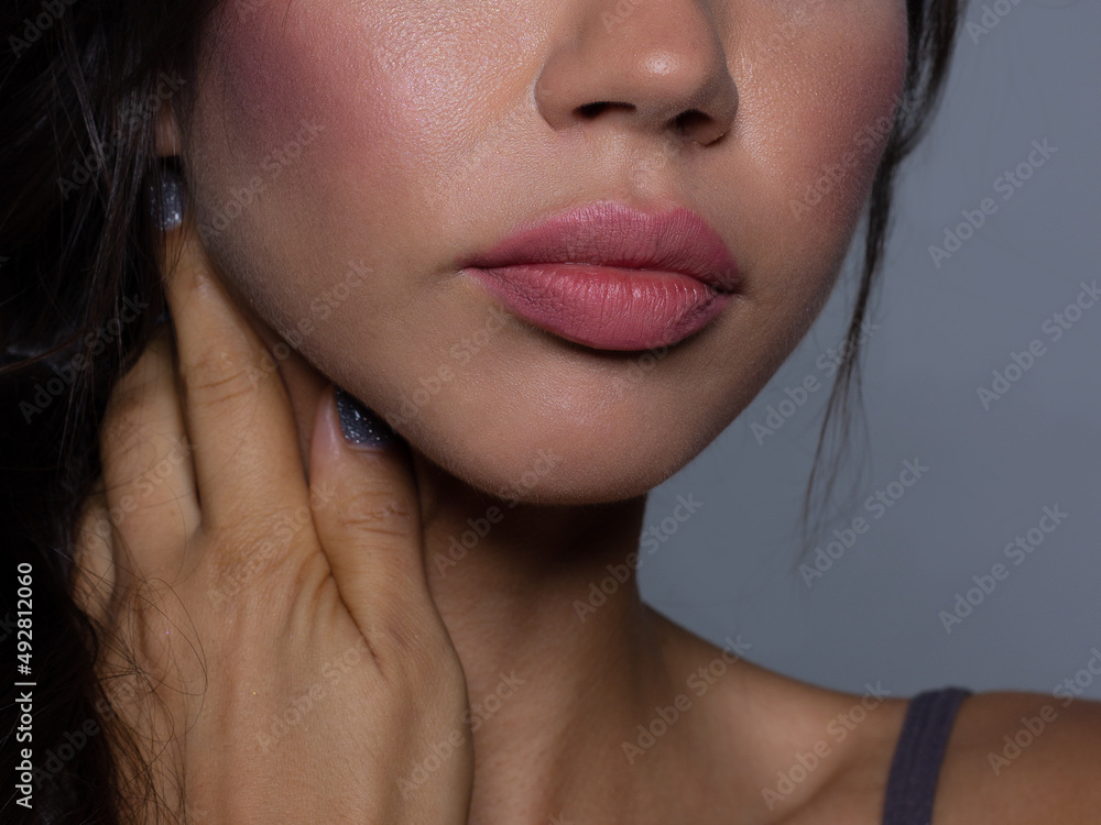 Close-up perfect lip makeup beautiful female mouth. Plump sexy full lips. Macro photo face detail. Perfect clean skin, fresh lip make-up. Sweet pink lipstick, magenta color. Valentine's day style Close-up perfect lip makeup beautiful female mouth. Plump sexy full lips. Macro photo face detail. Perfect clean skin, fresh lip make-up. Sweet pink lipstick, magenta color. Valentine's day style
