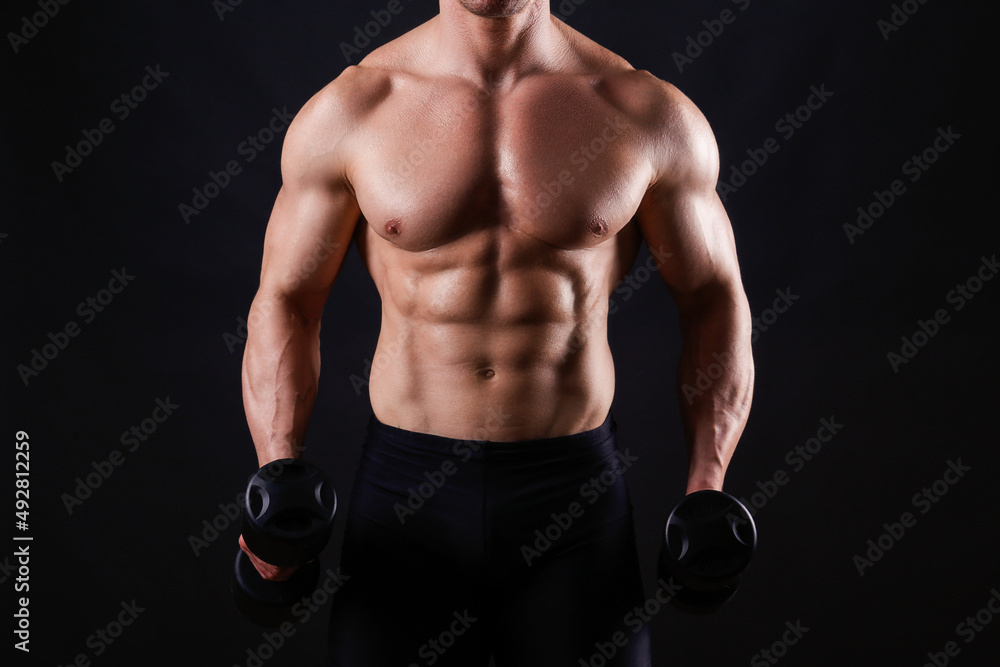 Professional bodybuilder performing exercise with dumbbells over