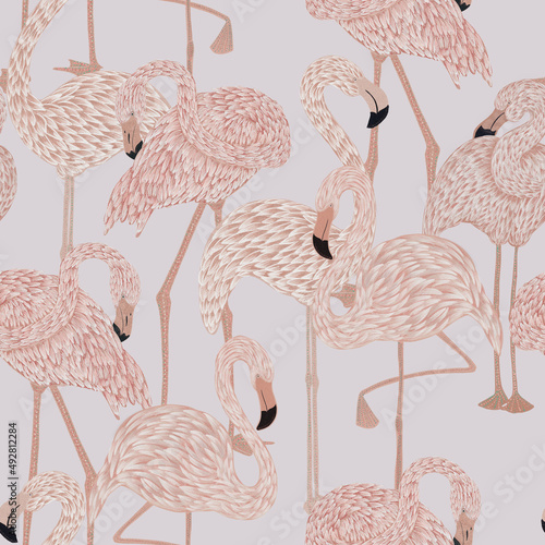 seamless pattern with graceful delicate pink flamingos in emerald rich lush exotic foliage. Graphic design surface pattern. Textile design, wallpaper decor photo