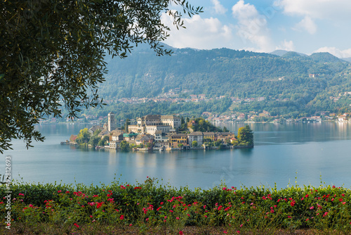 Orta lake with San Giulio island seen from the famous and picturesque town of Orta San Giulio, Italy photo
