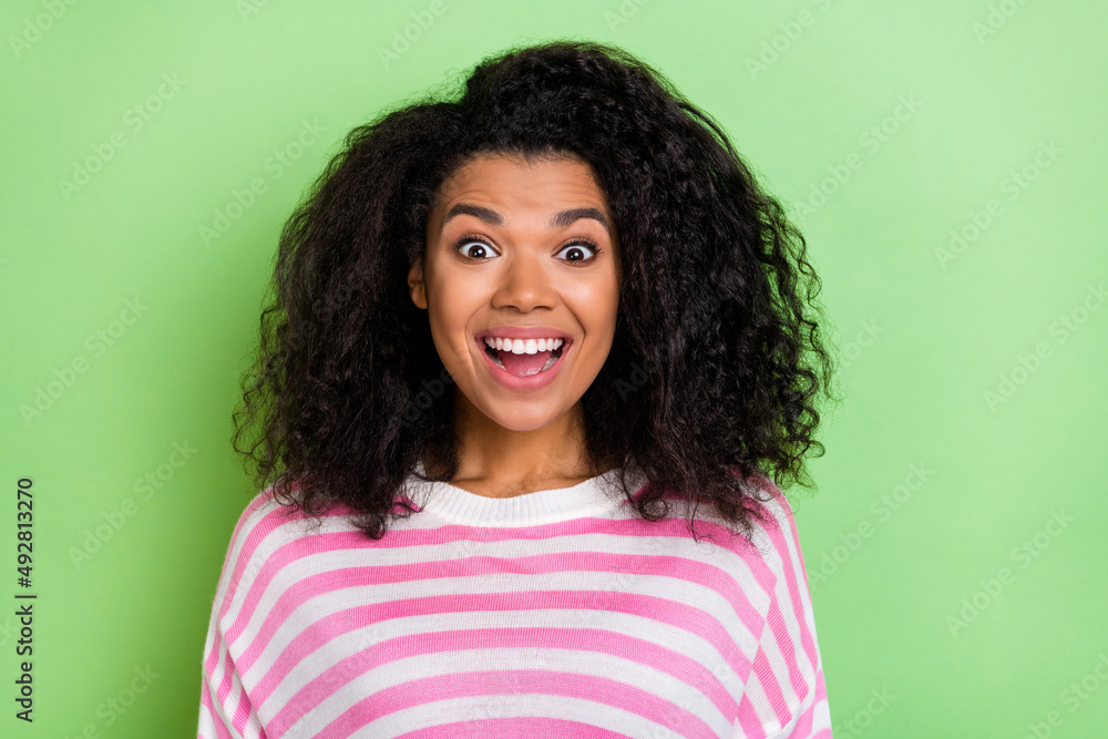 Photo of young excited pretty lady face reaction discount information isolated over green color background Photo of young excited pretty lady face reaction discount information isolated over green color background