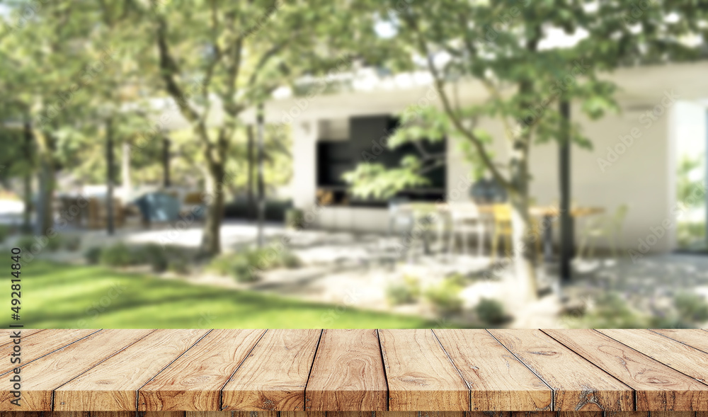 Wooden board empty table blurred garden background used for display products Wooden board empty table blurred garden background used for display products