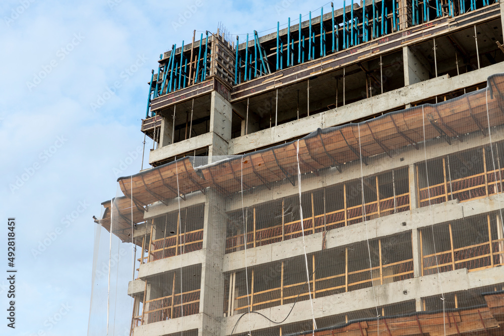 building detail under construction with protective screens building detail under construction with protective screens