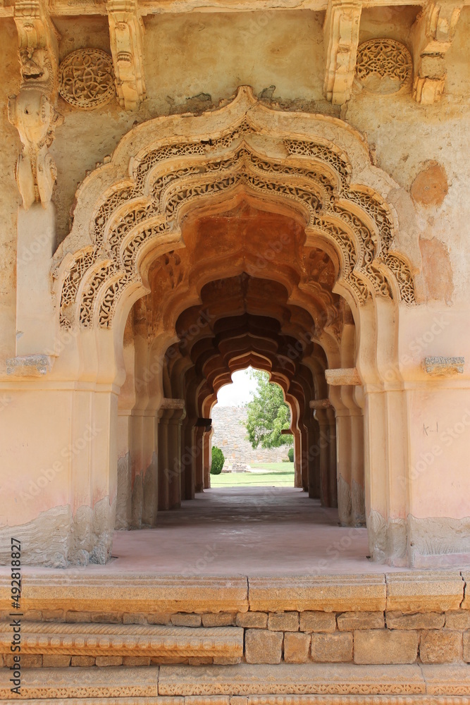 Entrance from the stone carving Lotus Mahal temple in Hampi Karnataka India a tipical indian architecture palace 