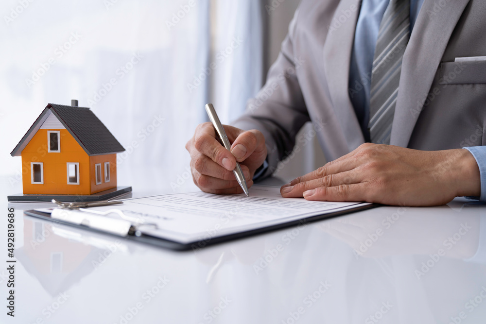 Signing home sales and insurance contracts with real estate agents