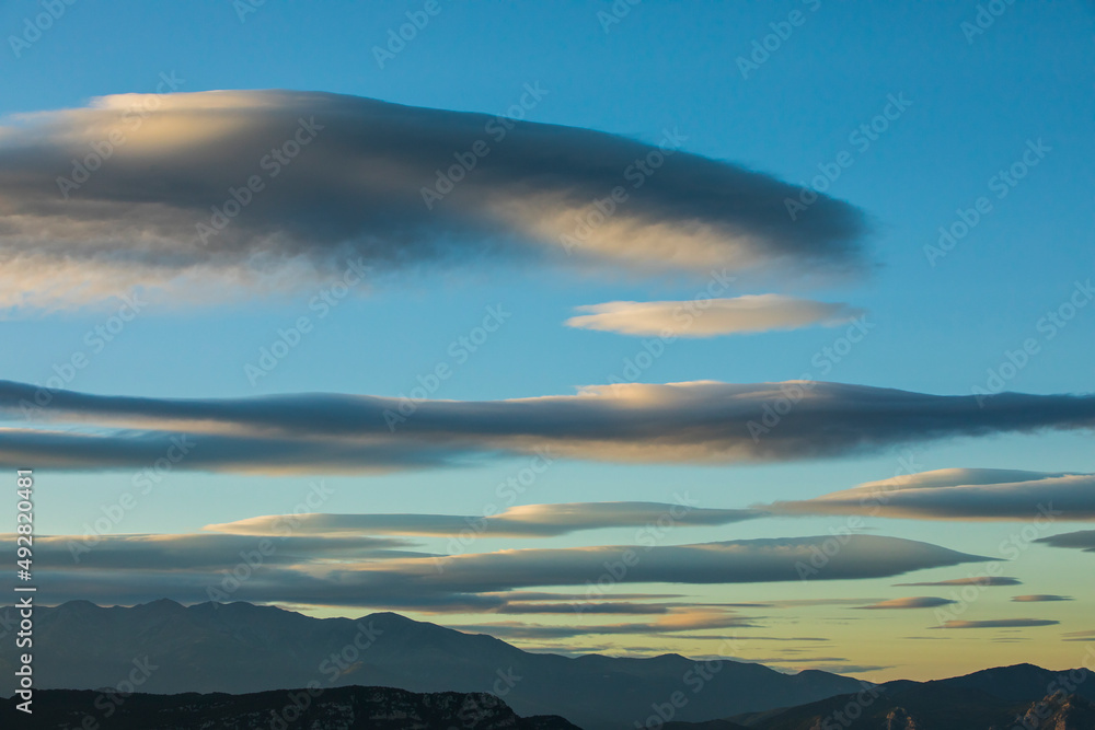 Sunset and wind clouds in La Garrotxa, Girona, Spain Sunset and wind clouds in La Garrotxa, Girona, Spain
