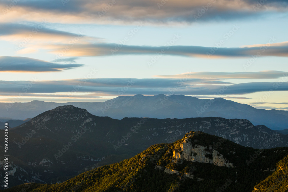 Sunset and wind clouds in La Garrotxa, Girona, Spain Sunset and wind clouds in La Garrotxa, Girona, Spain