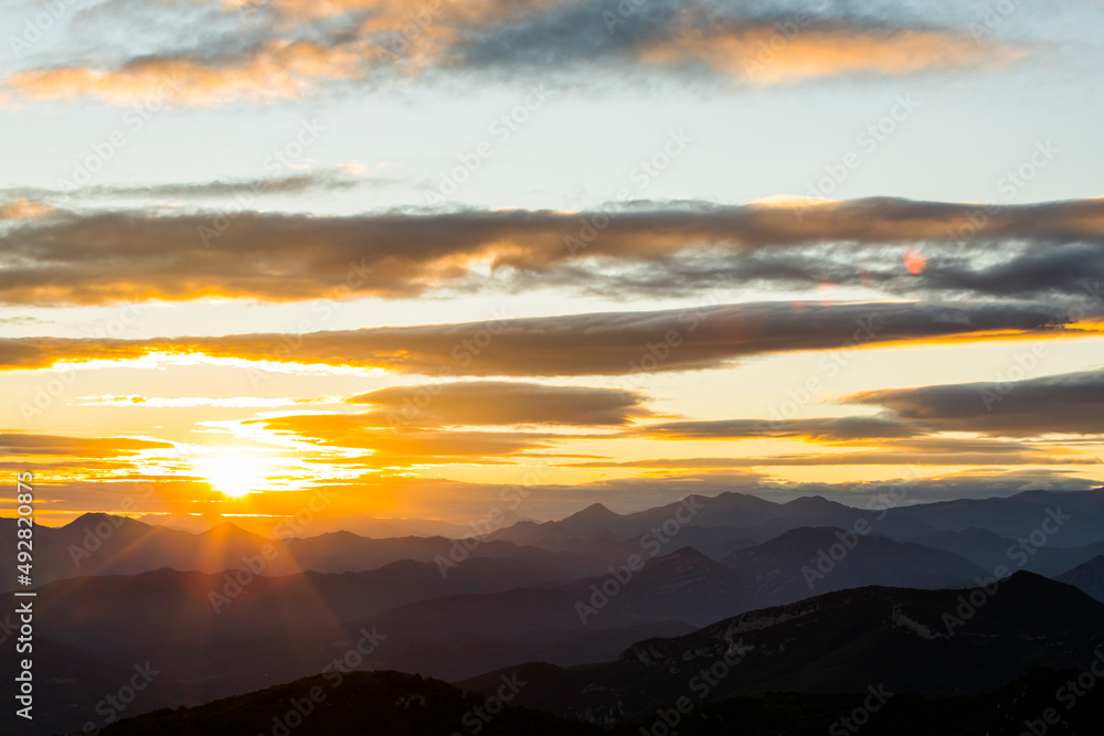Sunset and wind clouds in La Garrotxa, Girona, Spain Sunset and wind clouds in La Garrotxa, Girona, Spain