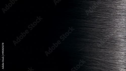 Vertical shot flight reflection passes through straight black hair | Anti dandruff concept photo