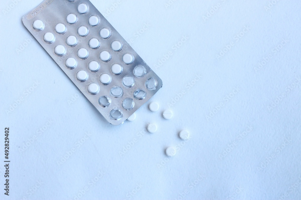 White pills on a white background. Medicines and vitamins. White pills on a white background. Medicines and vitamins.