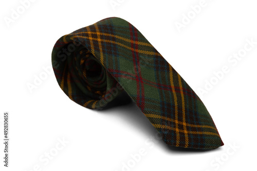 Studio photo of a rolled green plaid man's tie. The background is white