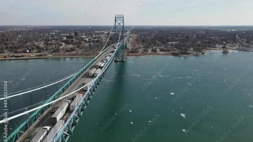 Truckers crossing USA - Canda border over Ambassador bridge in Detroit, aerial view Truckers crossing USA - Canda border over Ambassador bridge in Detroit, aerial view