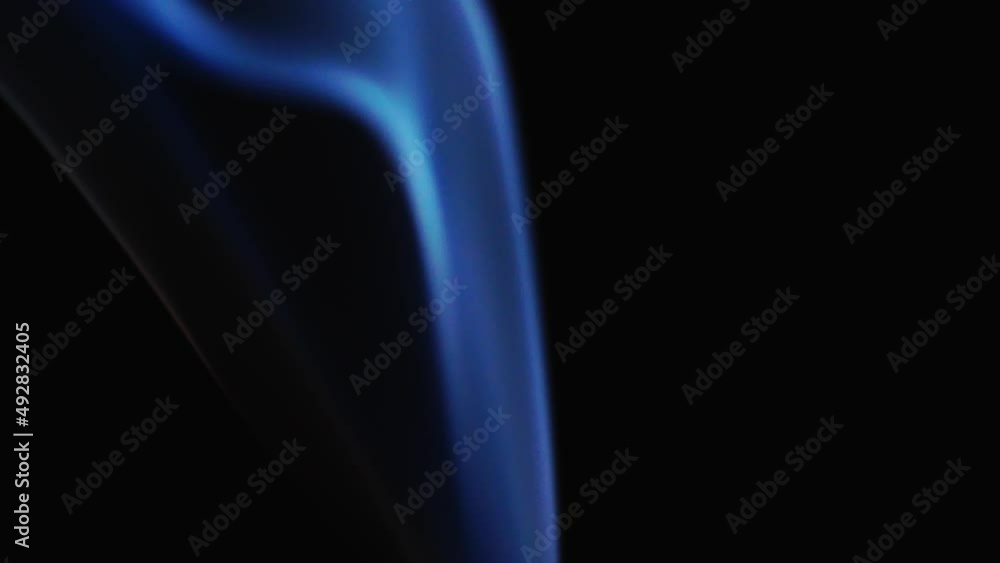 Abstract blue color smoke with a black background in slow motion. Realistic cloud smoke with streamline pattern. Abstract blue color smoke with a black background in slow motion. Realistic cloud smoke with streamline pattern.