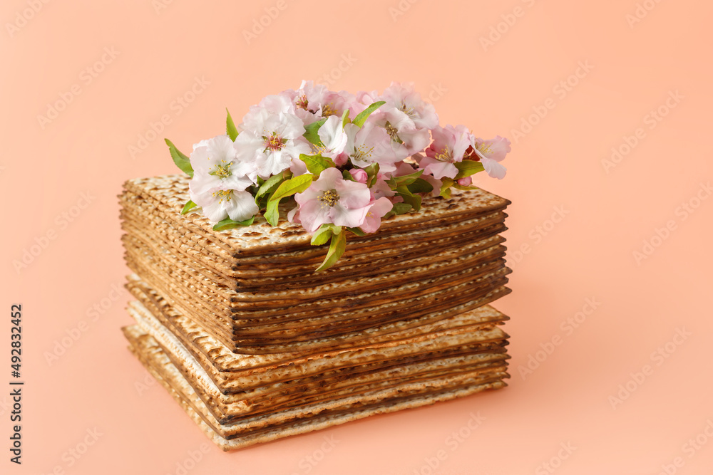 Matzo in the form of a cake, decorated with almond flowers. Pesach celebration concept (jewish Passover holiday)