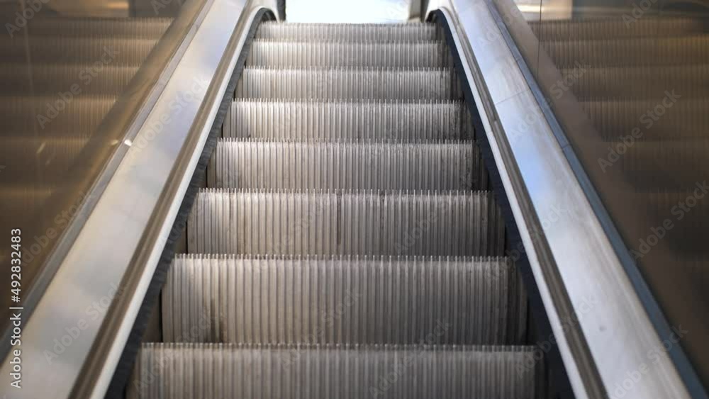 An empty escalator slowly bringing you to your destination An empty escalator slowly bringing you to your destination