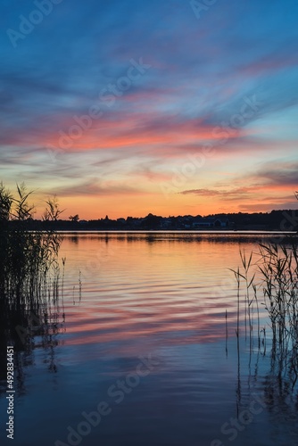 Beautiful colorful morning landscape. Wonderful sky over a Polish lake.