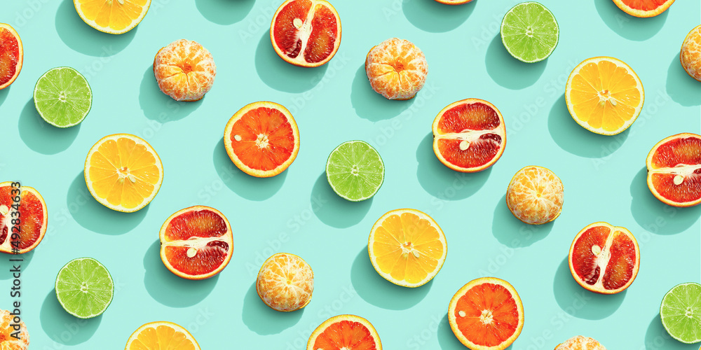 Citrus fruits as bring summer food pattern, grapefruit, orange, tangerine,  lemon, lime, red orange with shadow at sunlight on mint background. Healthy  fresh fruit food concept. Flat lay Stock Photo | Adobe