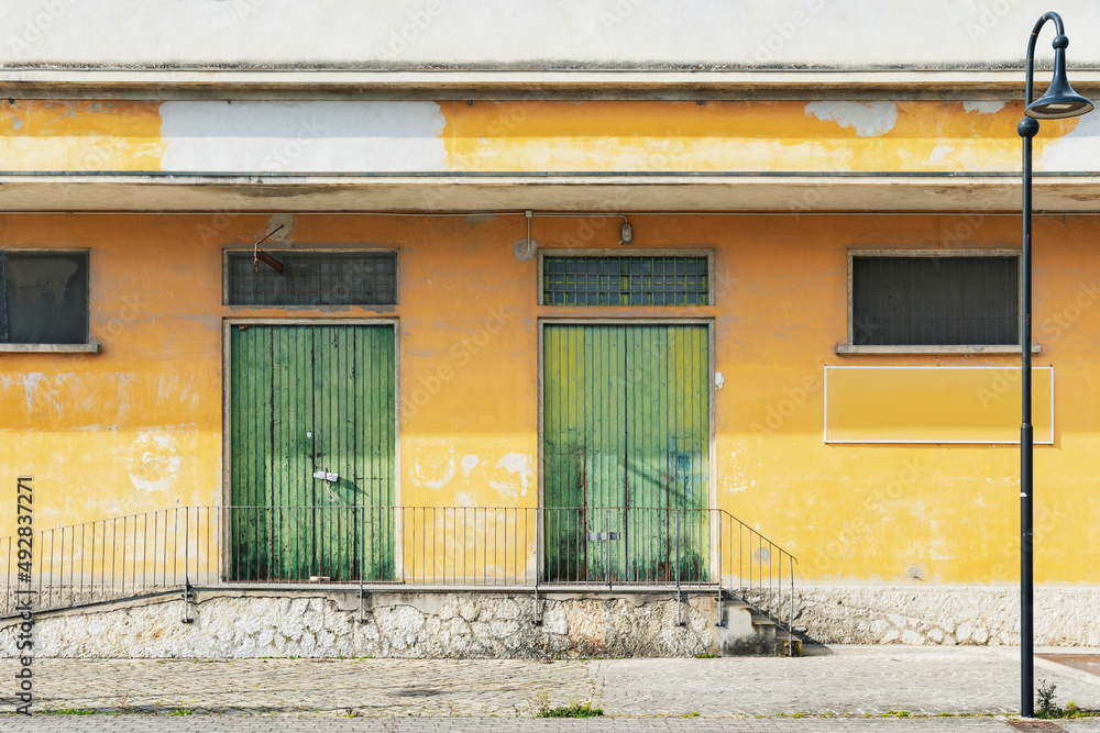 Yellow facade doors and windows, old architecture Yellow facade doors and windows, old architecture