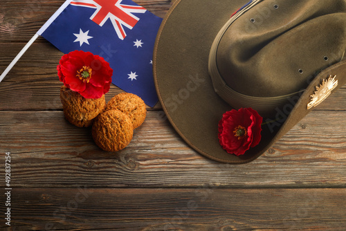 Australian Anzac Day. Australian army slouch hat and traditional Anzac biscuits on wooden background. photo