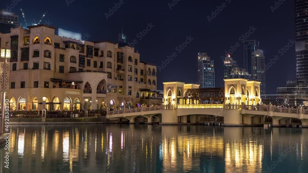 The bridge near the biggest musical fountain in Dubai day to night timelapse. Dubai, UAE The bridge near the biggest musical fountain in Dubai day to night timelapse. Dubai, UAE