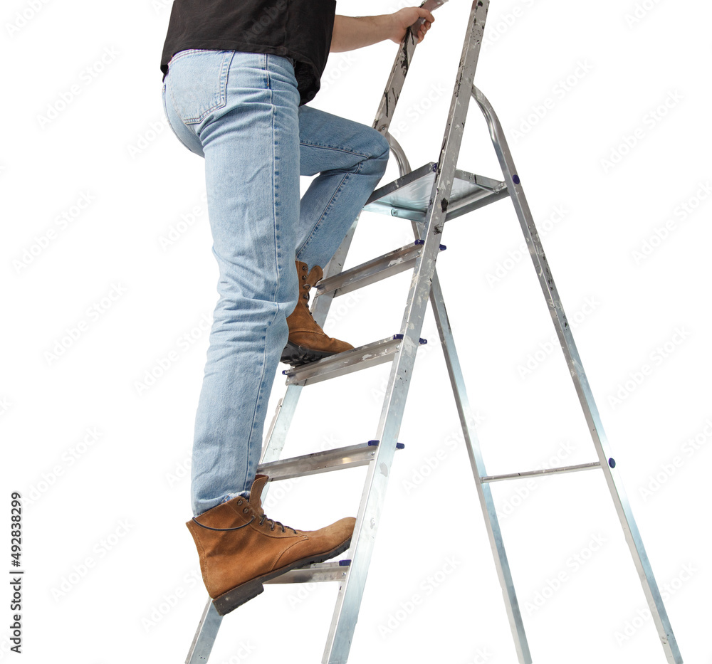 Legs of a man in jeans on a stepladder