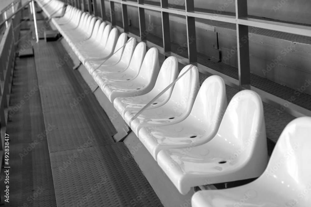 Fototapeta premium White seats on the stadium tribune.