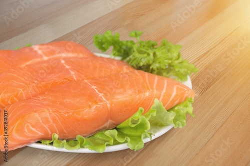 Fresh fish fillet. On a wooden background.