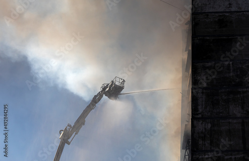 War in Ukraine. Firefighters on damaged residential building in Kyiv