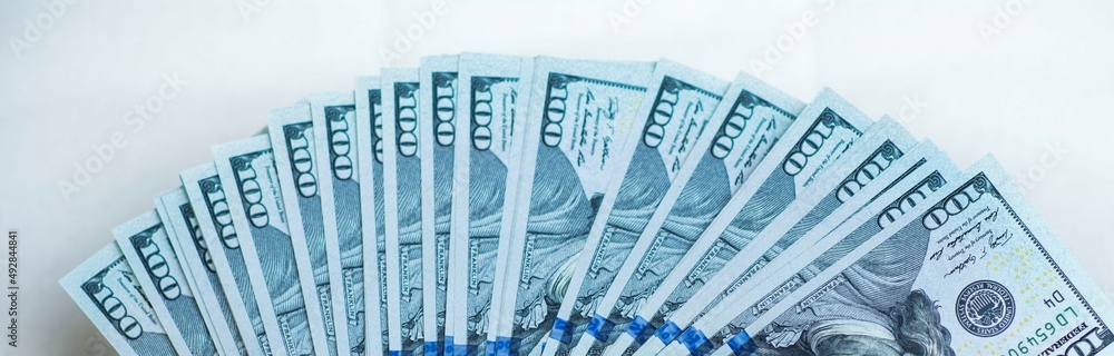 Fototapeta premium Fan of hundred dollars banknotes