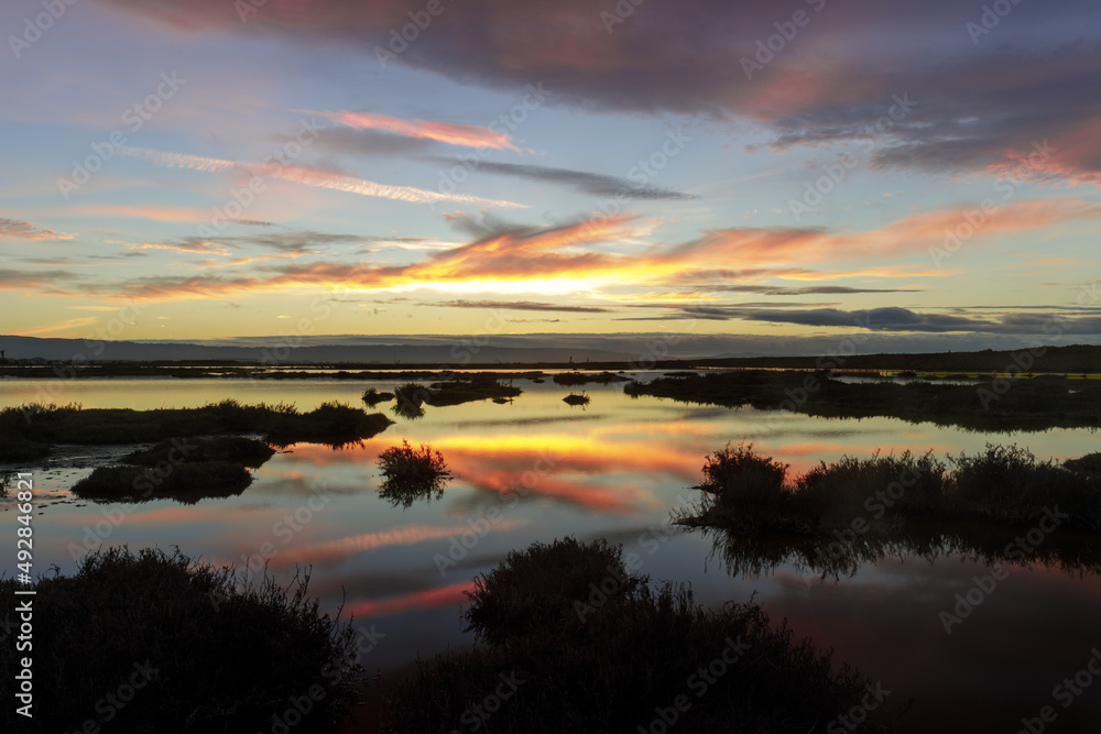 Marshlands Sunset Reflections via Don Edwards Wildlife Refuge in San Jose, California, USA.