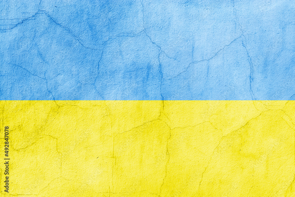 Flag of Ukraine painted on a concrete  broken wall.  Crisis in international relations, Russian military invasion of Ukraine