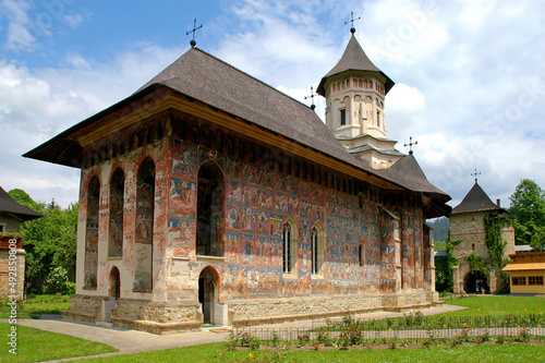 Moldovitsa Monastery, Suceava County, Moldavia, Romania: One of the famous painted churches of Moldavia. This is the Annunciation Church with colorful medieval frescos. photo