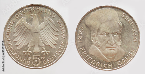 5 Deutsche Mark coin of the Federal Republic of Germany with the cote of arm eagle and a portrait of the German mathematician, statistician, astronomer, geodesist,  and physicist Carl Friedrich Gauss. photo