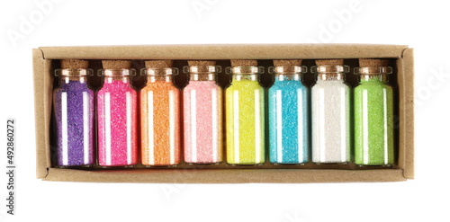 Glitter colorful set in glass bottle isolated on white