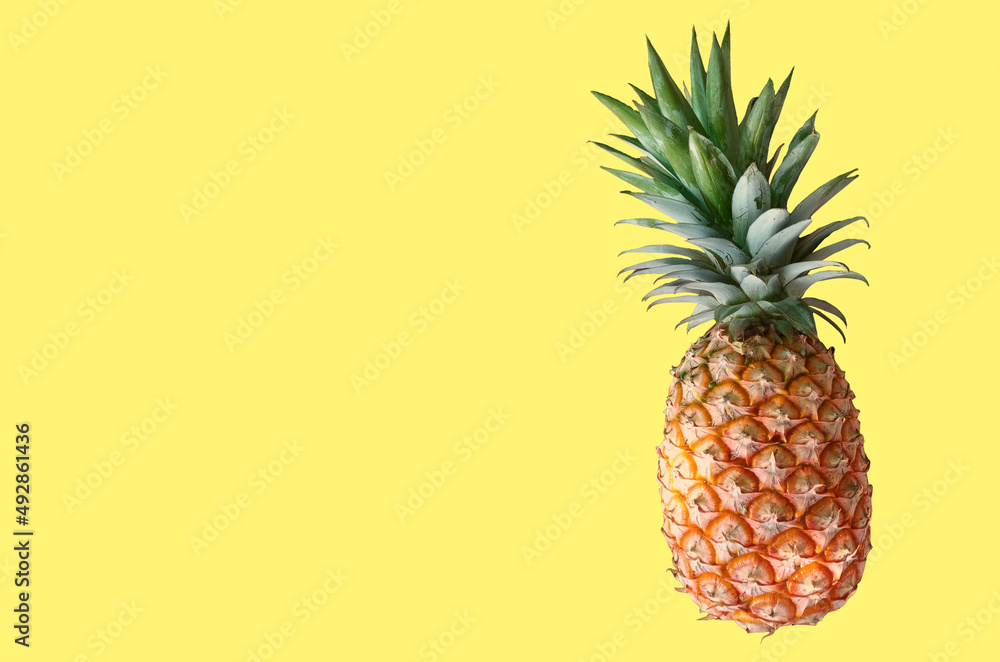 Top veiw, Single pineapple ripe isolated on yellow background for stock photo or design advertising product, wallpaper,thai fruit summer Top veiw, Single pineapple ripe isolated on yellow background for stock photo or design advertising product, wallpaper,thai fruit summer