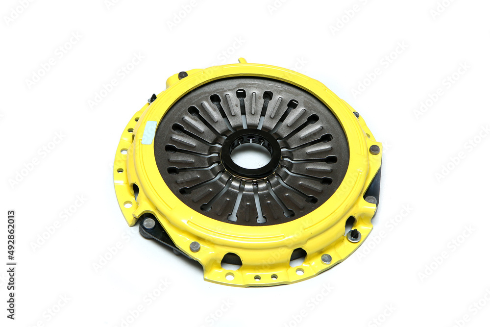The brand new sport clutch for the car engine isolated in a white background. The brand new sport clutch for the car engine isolated in a white background.