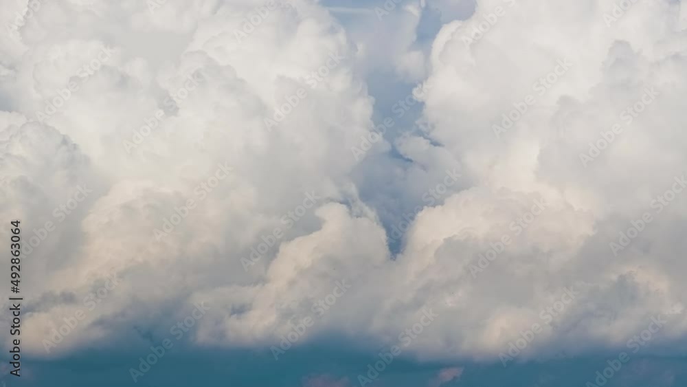 Timelapse of white puffy cumulus clouds forming on summer blue sky. Moving and changing cloudscape weather Timelapse of white puffy cumulus clouds forming on summer blue sky. Moving and changing cloudscape weather