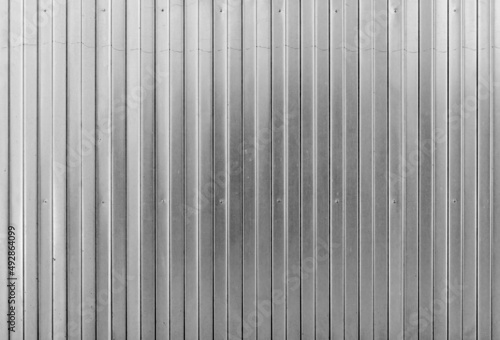 Shiny ridged metal wall, background texture