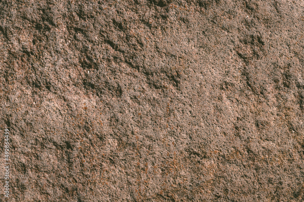 texture of rough bright brown granite boulder rock texture of rough bright brown granite boulder rock