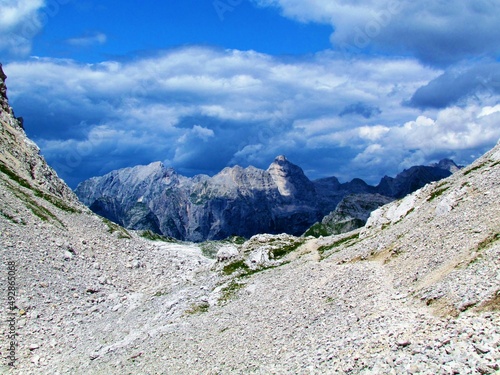 View of mountains Pihavec and Bovski Gamsovec in Triglav national park and Julian alps from a mountain pass above Prehodavci photo