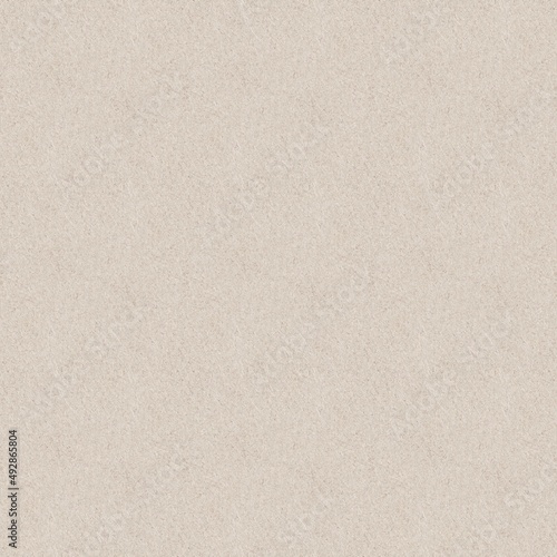 A sheet of seamless light brown spotted craft paper texture as background