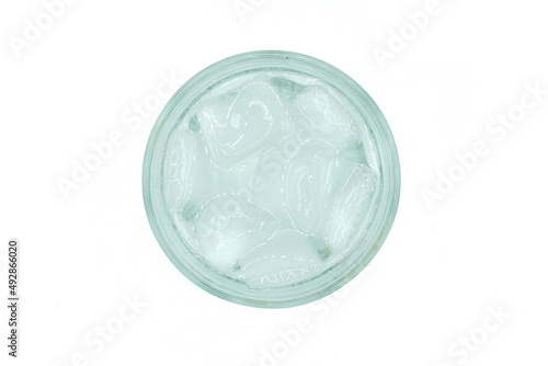 Water with ice cubes in glass isolated on white background top view