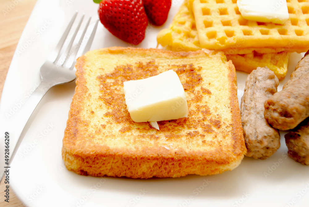Fried French Toast served on a Plate with Butter