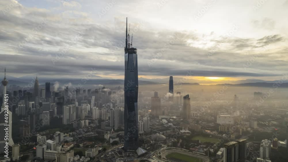 Aerial time lapse (hyperlapse) cinematic shot at Kuala Lumpur city skyline during sunrise. Aerial time lapse (hyperlapse) cinematic shot at Kuala Lumpur city skyline during sunrise.