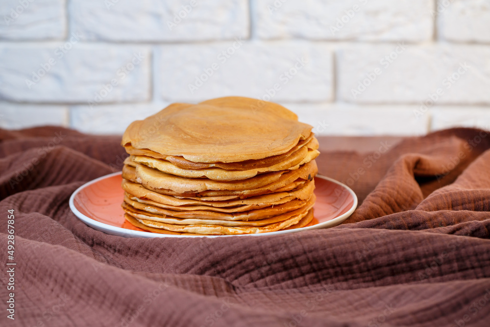 Delicious homemade fried pancakes with natural ingredients, plate with homemade pancakes