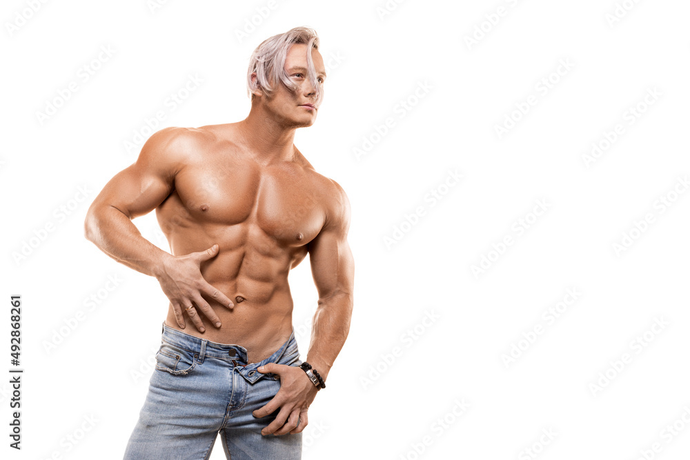 Strong healthy athletic man in jeans isolated on white. Strong healthy athletic man in jeans isolated on white.