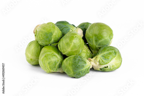Fresh organic Brussels sprouts on white background.