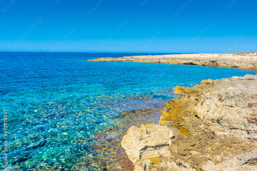 Amazing crystal clear water in the beach of Porto Selvaggio Natural Reserve in Salento, Apulia Italy